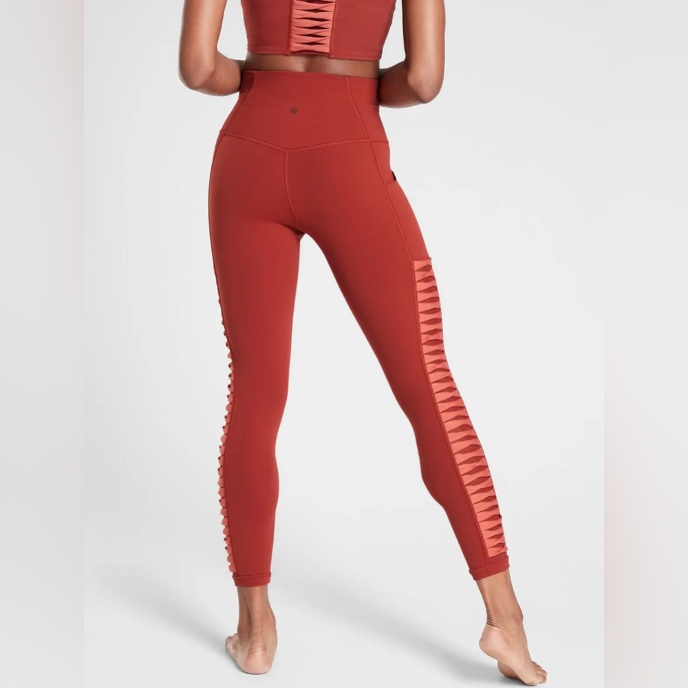 Athleta Salutation Stash Pocket II Twist 7/8 Tight in Russet Orange High Rise S